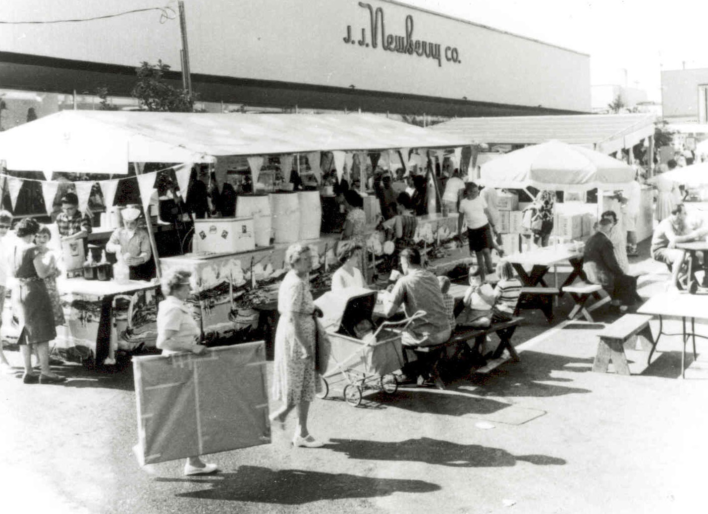 Black and white image of early Artsfair outside J.J. Newberry Co.