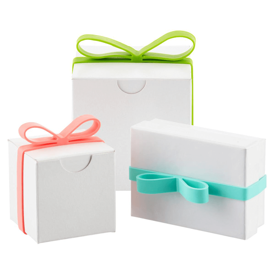 Elastic reusable ribbon bands wrapped around small boxes.