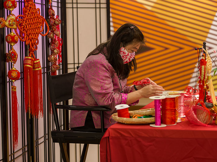 Artist working on Chinese Knot Tying