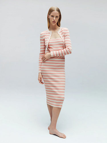 Model in stripe dress and cardigan