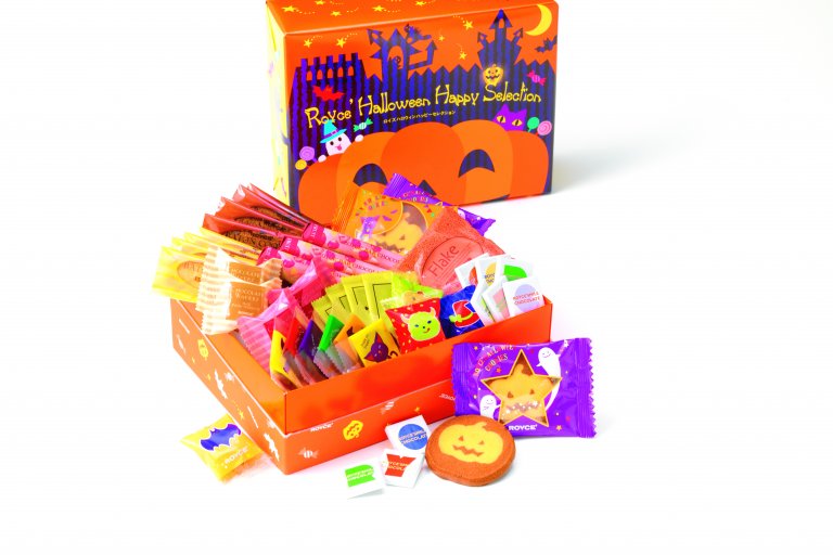 A brightly colored selection of candies from ROYCE' Chocolate in a Halloween box.