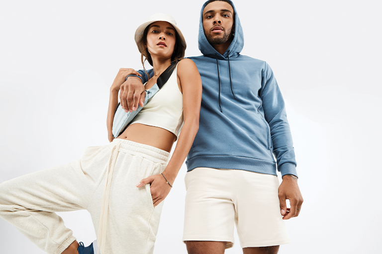 A man and woman model Fabletics fashions