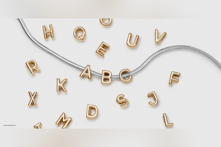 Our iconic alphabet charms, now in 14k gold plating with a fresh new look and size. Perfect for personalizing your summer style.