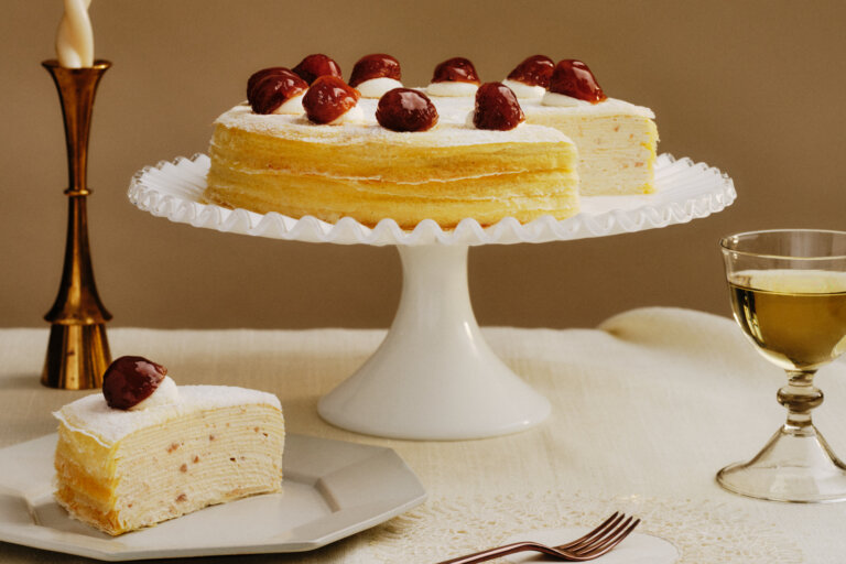 Sink your fork through and discover the endless layers of lacy crêpes and lush whipped chestnut pastry cream, crowned with a flurry of powdered sugar and glazed chestnuts.